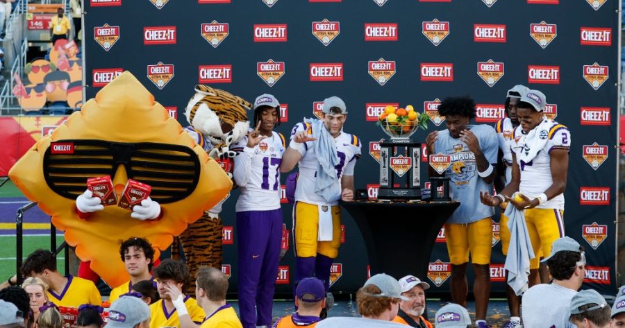 ORLANDO, FL - JANUARY 02: LSU Tigers wide receiver Chris Hilton Jr. (17), LSU Tigers quarterback Garrett Nussmeier (13), LSU Tigers wide receiver Malik Nabers (8), and LSU Tigers wide receiver Kyren Lacy (2) pose with the trophy after the Cheez-It Citrus Bowl between the LSU Tigers and the Purdue Boilermakers on January 2, 2023 at Camping World Stadium in Orlando, Fl.  (Photo by David Rosenblum/Icon Sportswire)
